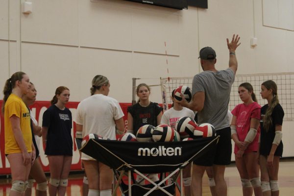 The girls' volleyball team works hard at the gym in preparation for the upcoming season.